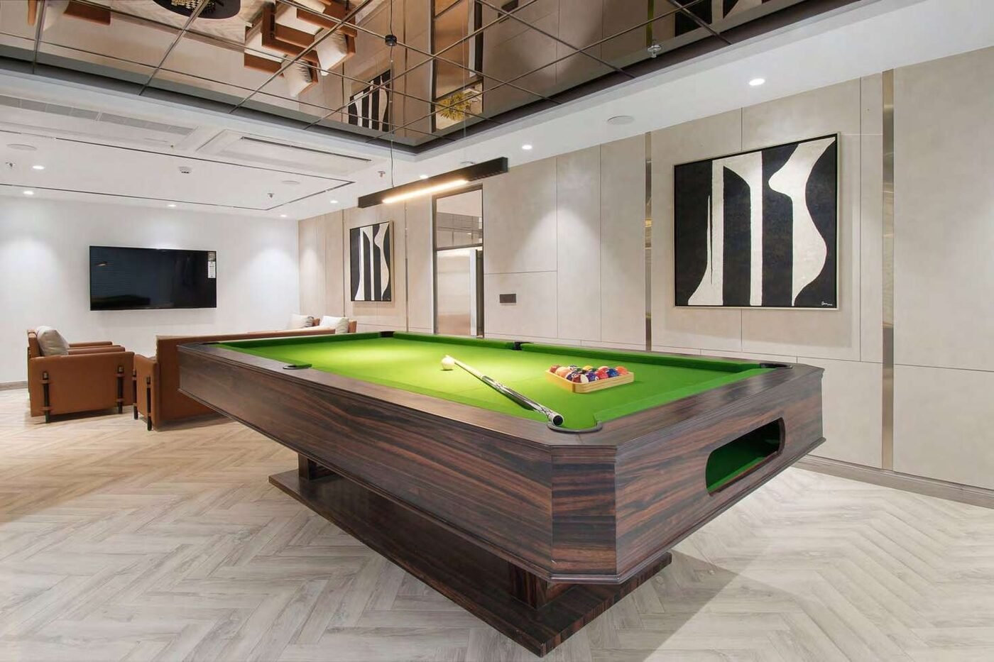Executive lounge with billiards table and mirrored ceiling
