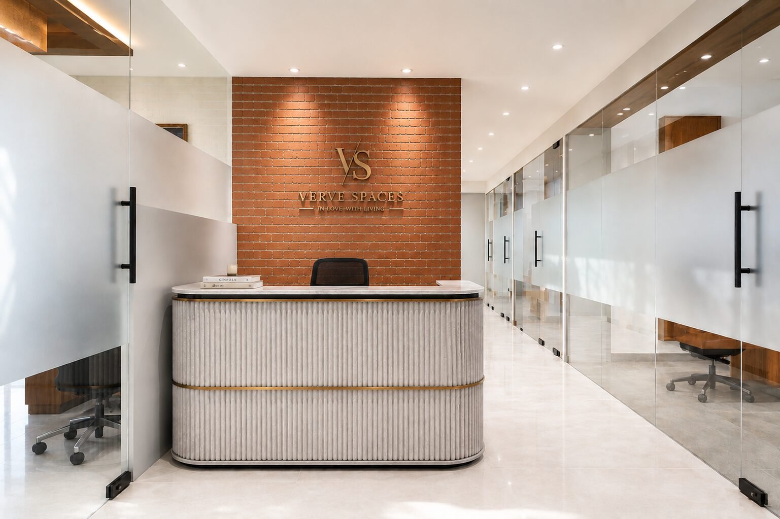 Verve Spaces studio reception with brick feature wall and brass logo