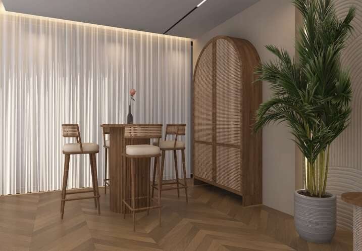 Breakfast bar beneath an arched rattan door with potted palm